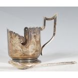 An early 20th Century Russian silver cup holder having a scalloped rim with pierced decoration being