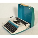 A vintage 20th Century Smith Corona Zephyr II typewriter in a tea resin carry case.