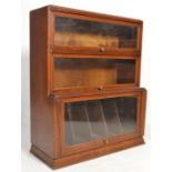A 1930's Art Deco oak lawyers / barristers bookcase cabinet. The upright with breakfront base having