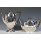 A vintage 20th Century Walker and Hall matching silver plated coffee pot and teapot of typical