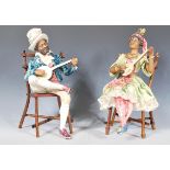 A pair of mid 20th Century ceramic continental creole band figures seated upon bamboo chairs playing