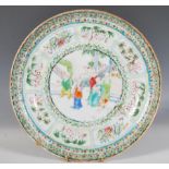 A 19th Century Chinese famille verte plate decorated with hand painted enamels, the central panel