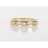 An English hallmarked 9ct gold ring set with round cut white stones. Hallmarked Birmingham. Weight