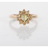An unmarked but tests as 9ct yellow gold ladies dress ring set with a central green cabochon