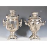 Two early 20th Century white metal samovars of similar form, one having a bulbous tapering  body the