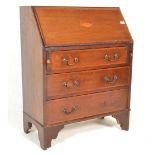 An Edwardian mahogany inlaid bureau desk being raised on bracket feet with a series of drawers under