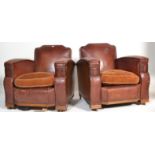 A pair of early 20th Century Art Deco club armchairs upholstered in riveted red leather with