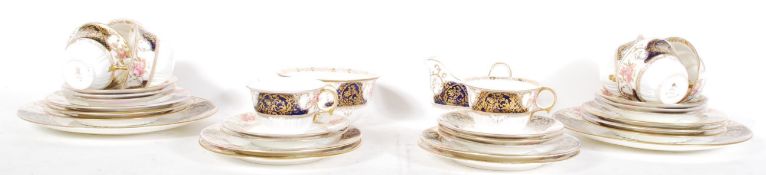 An early 20th Century Wedgwood bone china part tea service, consisting of treios, sugar bowl creamer