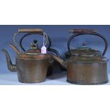 A group of copper kettles dating from the 19th Century Victorian era and latter examples to
