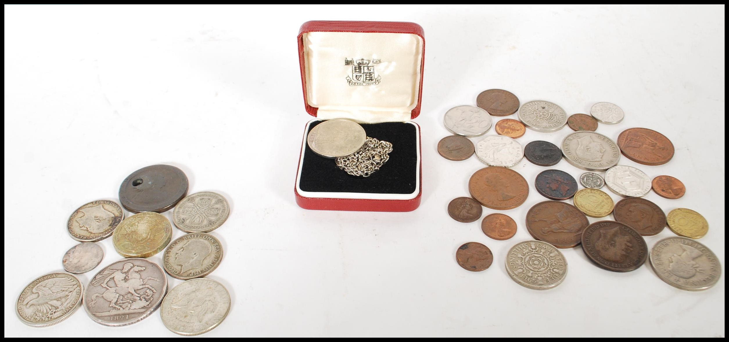 A collection of coins dating from the early 19th Century to include a George IV 1821 crown with