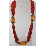 A selection of 20th Century North African Moroccan necklaces to include a beaded necklace with mille