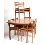 A good retro mid 20th Century teak extending dining table raised on square supports with central
