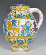 A Faience ware large bulbous guild jug having hand painted polychrome decoration of lions hunting