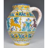 A Faience ware large bulbous guild jug having hand painted polychrome decoration of lions hunting