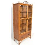 A Victorian Aesthetic movement bamboo vitrine / display cabinet having an open window twin glass