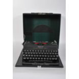 A vintage early 20th Century British made Imperial Good Companion Model T portable typewriter with
