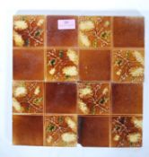 A set of four Victorian Staffordshire majolica tiles each of sectional design having floral