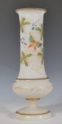 A 19th Century Victorian Bristol milk glass pedestal vase, gilt rim and detailing, the slender