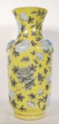 A Chinese antique porcelain baluster vase having a yellow ground decorated with hand painted peonies