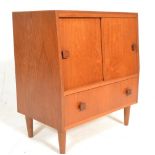 A retro 20th Century teak wood music / stereo cabinet having a configuration of doors and drawers