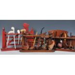 A collection of vintage and antique pipes over three pipe racks to include carved examples, briar,