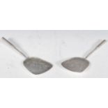 A pair of 20th Century silver serving utensils having decorative florals and butterflies with