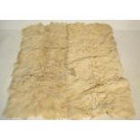 A pair of 20th Century retro vintage Scandinavian long haired sheepskin fireside floor rugs.