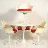 After Eero Saarinen - A contemporary tulip type dinning suite comprising of four white formed