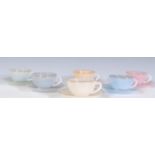 A vintage 1930's Art Deco French pearlware ceramic tea set to include six cups and saucers in pastel