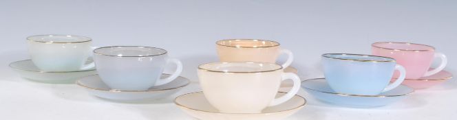 A vintage 1930's Art Deco French pearlware ceramic tea set to include six cups and saucers in pastel