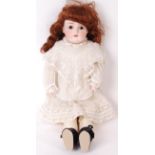 ANTIQUE BELIEVED ARMAND MARSEILLE BISQUE HEADED LEATHER DOLL