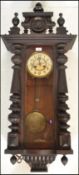 A 19th Century Vienna regulator pendulum wall cloc