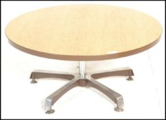 A retro 20th Century oak topped round coffee table