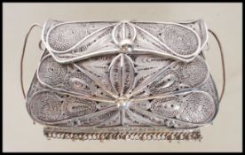 A 20th Century unmarked silver white metal filigre
