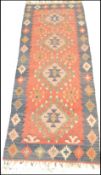 A vintage 20th Century woolen kilim rug having a b