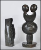 Two 20th Century soapstone sculptures of figural f