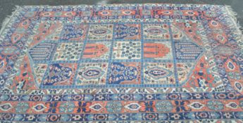 A large early to mid 20th Century woollen floor ru