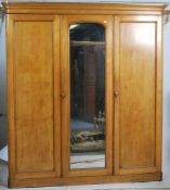 A 19th century Victorian ash triple wardrobe linen