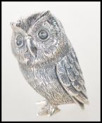 A sterling silver novelty figurine of an owl. Stam