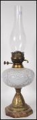 A Victorian 19th century oil lamp having a central