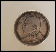 A Republic of China year 10 silver dollar having Y