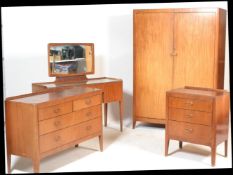 A mid 20th Century vintage retro Gordon Russell bedroom suite comprising of a walnut dressing