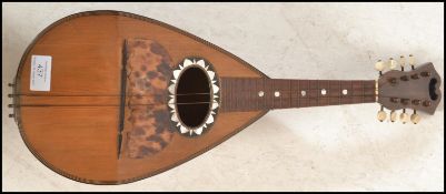 An early 20th Century antique eight string mandoli