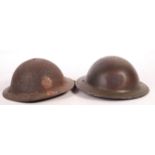 TWO WWII SECOND WORLD WAR STEEL BRODIE HELMETS