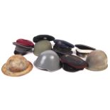 COLLECTION OF ASSORTED MILITARY UNIFORM HELMETS & CAPS