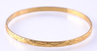 A HIGH CARAT GOLD ASIAN BANGLE