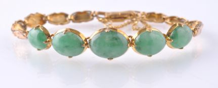 A GOLD & NATURAL JADE BRACELET WITH 5 JADE CABOCHO