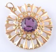 AN 18CT GOLD AND PURPLE GEM PENDANT BROOCH