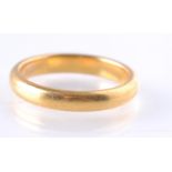 A HALLMARKED 22CT GOLD BAND RING