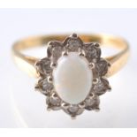 A 18CT GOLD OPAL & DIAMOND CLUSTER RING